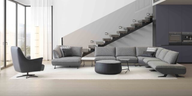 hOEKSALON OP MAAT-gRIJZE STOFFEN SOFA-zWARTE POOTJES-MECHANISME-MODULAIR SYSTEEM-ELEGANTE SOFA-ZITBANKEN-DESIGN MEUBELS